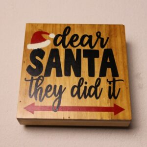 Box sign in rich oak stain for holiday cheer. Fun holiday message featuring Santa's hat.