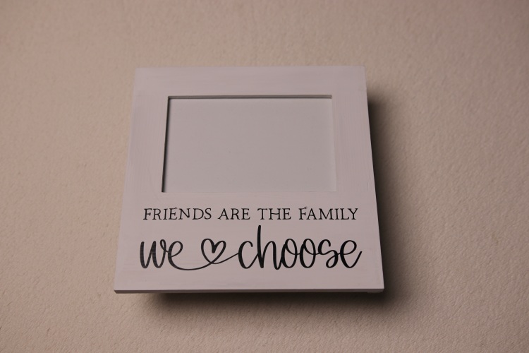 Friends and family photo frame. White paint with fun, warm loving font.