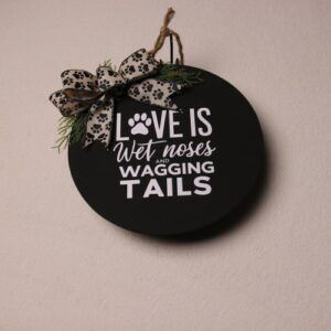 10 inch wooden circular sign. Black painted with fun white lettering featuring a paw print. A dog lover's perfect home decor piece.