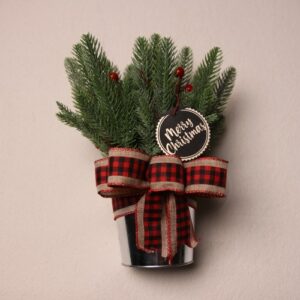 Small table-top holiday decoration. Metal pale full of faux pine needles and pine cones. Complete with cute black and silver Christmas gift tag reading "Merry Christmas" in fun festive font. Red, black, and tan checkered ribbon to complete the Christmas Cheer.
